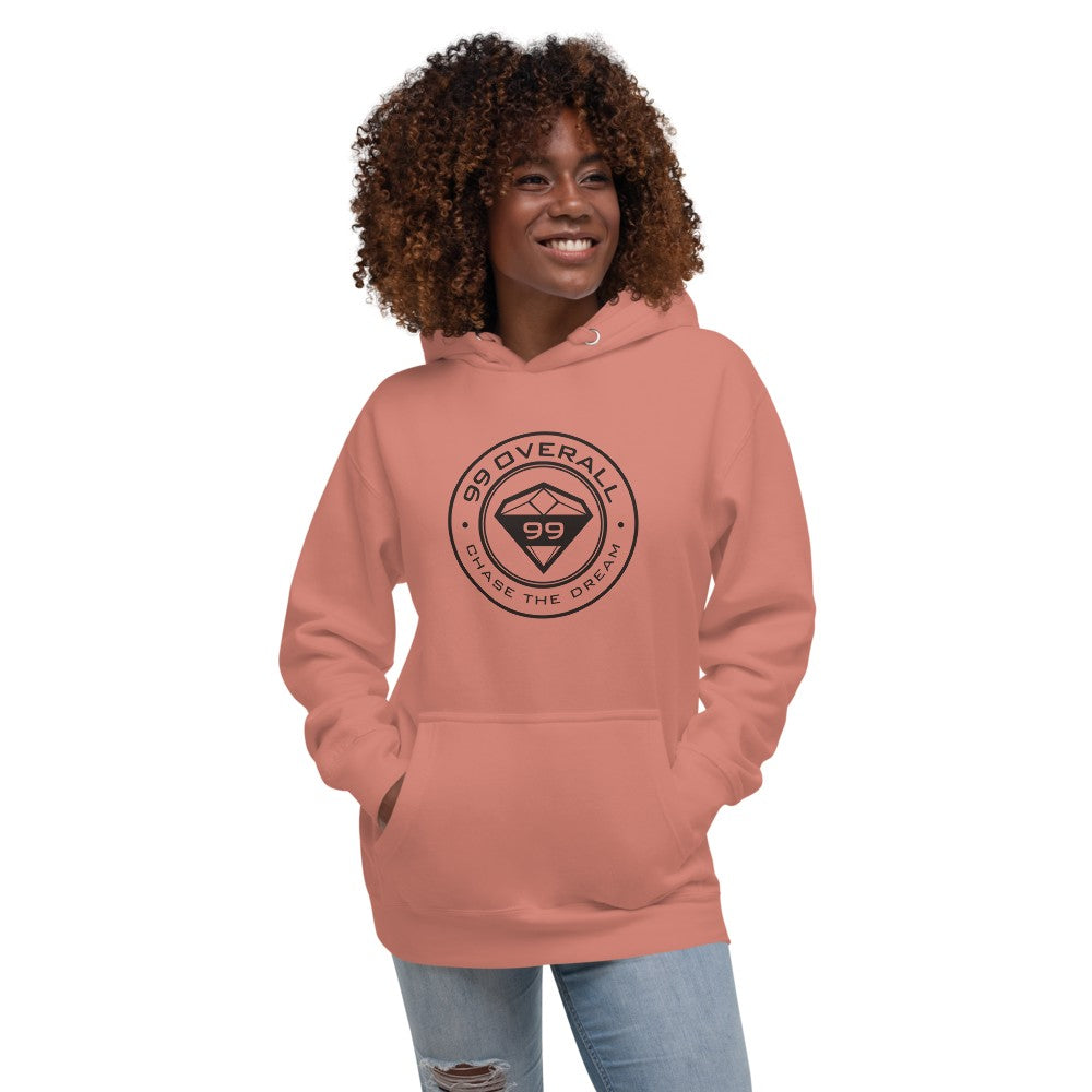 Smiling woman wearing the Dusty Rose Diamond 99 Badge Hoodie